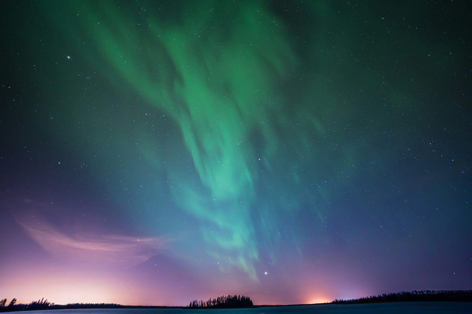 Aurora borealis in a dark sky with stars